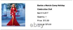 Poupée de Noël Barbie Signature Mariah Carey 2023 en robe rouge, en main